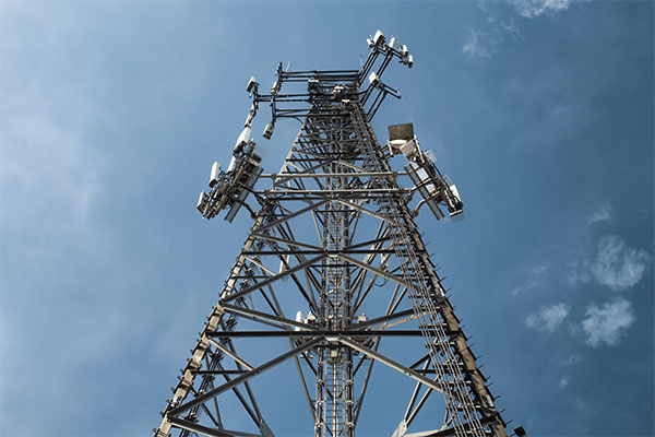 a tall tower with lots of antennas on top of it.